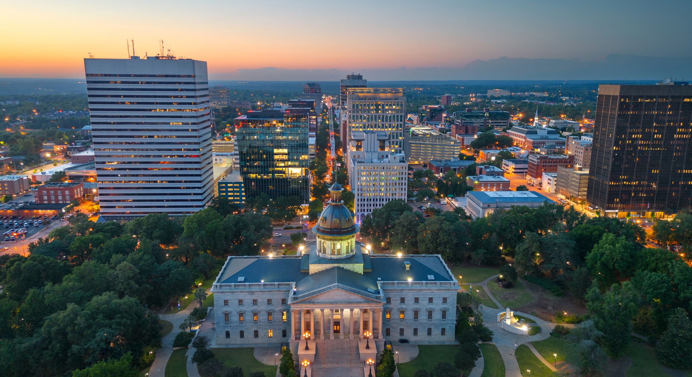 Aerial view of cityscape at sunset.